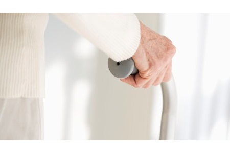 Elderly Hand Holding Cane --- Image by © Royalty-Free/Corbis