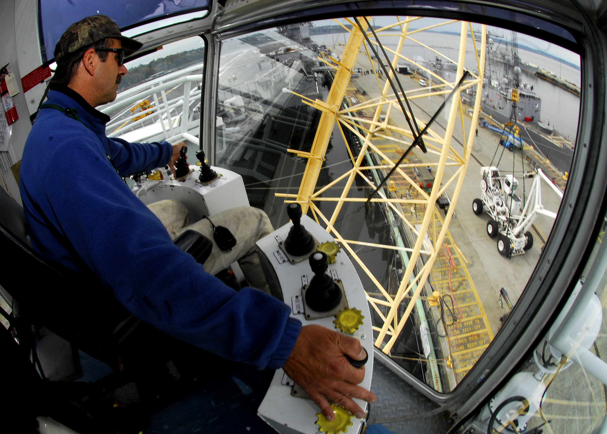 071009-N-1745W-089
EVERETT, Wash. (Oct. 9, 2007) Ð A Puget Sound Naval Shipyard crane operator moves an emergency heavy lift crane from the flight deck of USS Abraham Lincoln (CVN 72) to the Naval Station Everett pier. The crane will undergo load testing at Naval Station Everett to recertify it for shipboard use before being loaded back aboard Lincoln. U.S. Navy photo by Mass Communication Specialist Seaman Brandon Wilson (RELEASED)